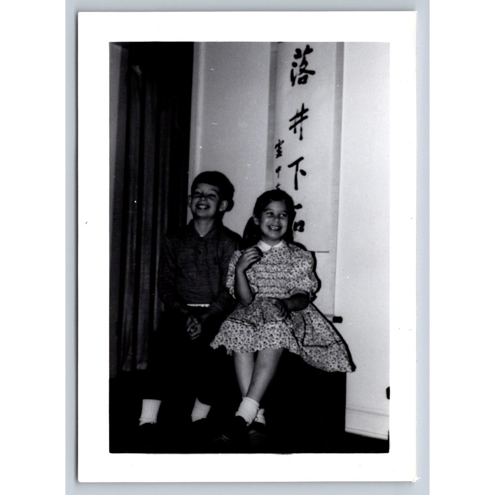 Vintage 1950s Snapshot Photo Smiling Children Asian Script Banner Cultural B&W